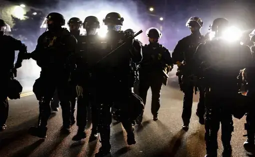 Police officers in riot gear.