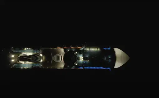 Aerial drone footage of a cruise ship at night