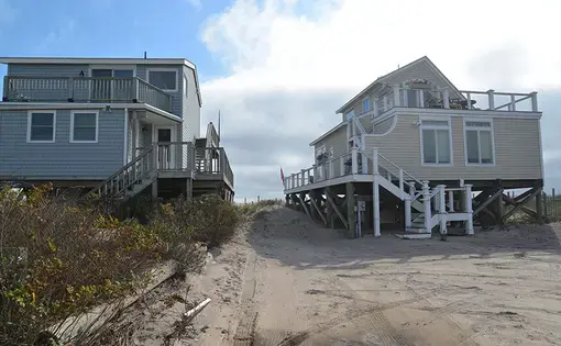 Beach houses on the shore.