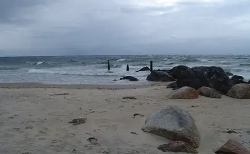 Sand leading to a beach coastline.