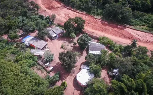 Aerial view of buildings in a forested area.