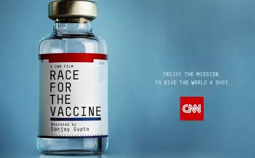 A vial of vaccine is labeled with the name of the film, "Race for the Vaccine"