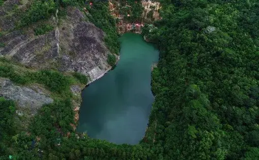 Tribun Manado/Finneke Wolajan. Lahan Eks Tambang PT Newmont Minahasa Raya kini telah direklamasi dan telah dijadikan Kebun Raya Megawati Soekarnoputri. Foto diambil Maret 2021.