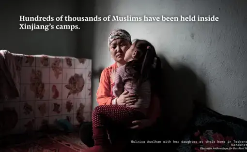 A woman holds a child.