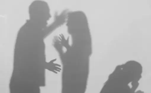 Silhouettes of quarreling parents and small child on white background.