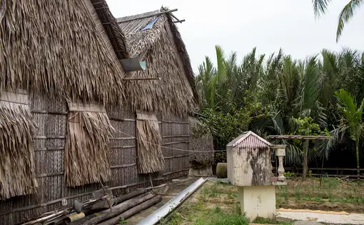 house covered and roofed with dried mangrove palm leaves