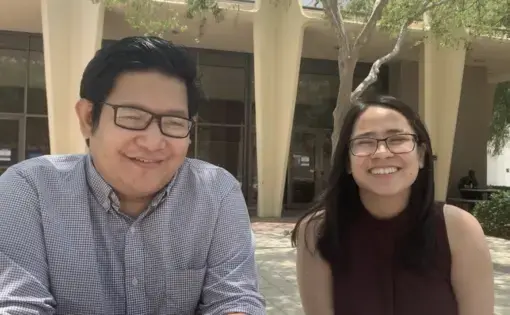 Man and woman sit next to each other