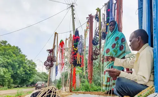 couple sits with ropes they sell
