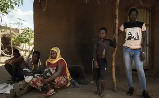 man sits with brother at foster home