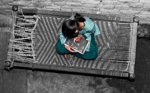 girl sitting on a mat
