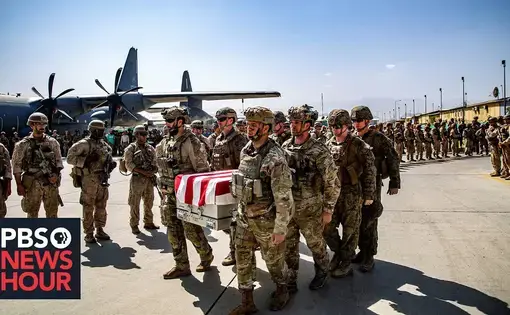 Soldiers carry caskets