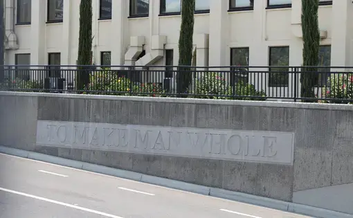 Sign reads &quot;to make man whole&quot;