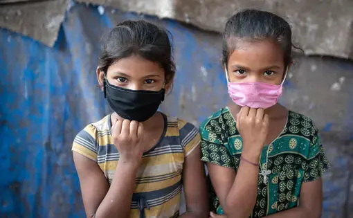 Masked children in Mumbai India.