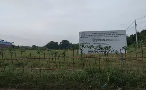 The empty field with a sign post on the site of Agrinas's Research and Development Center, or Agrinas Capability Center, in Kertarahayu village, Bekasi Regency, West Java, September 27, 2021.