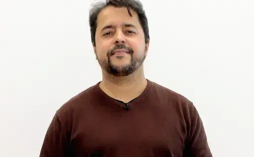 Carlos Minuano wearing a red sweater