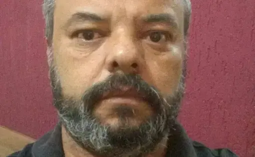 A man wears a black shirt.