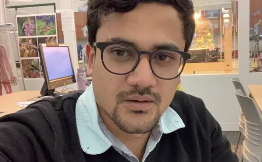 Imran studying at the Science Center at Truman College