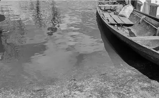 A boat lies on water.