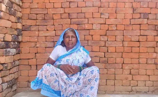 woman sits on ground
