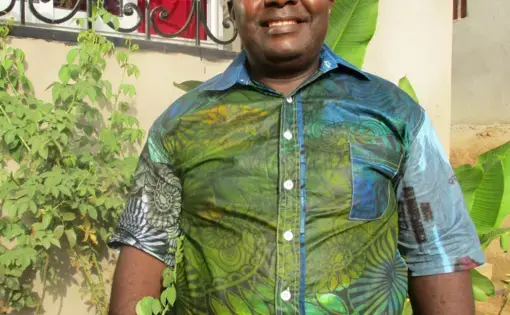 A man wears a green shirt.