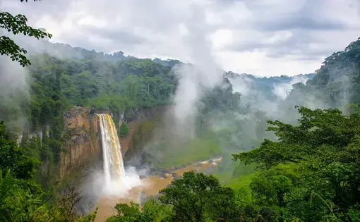 A waterfall is in the foreground.