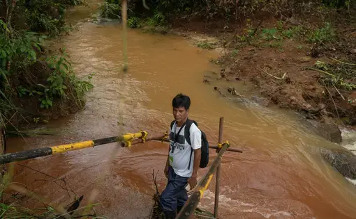 Man wading in sewage water