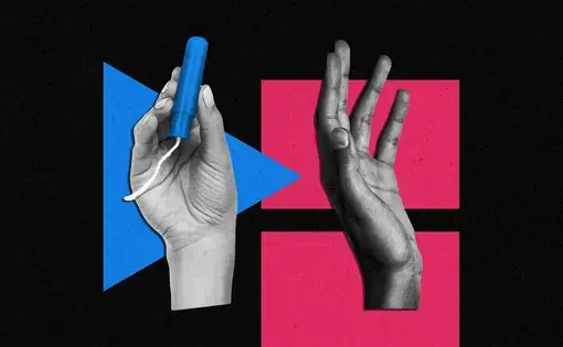 a hand holding a tampon