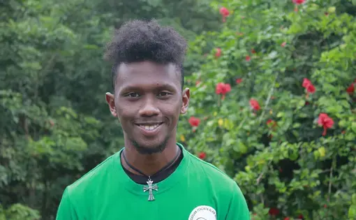 Image of a person wearing a green shirt.