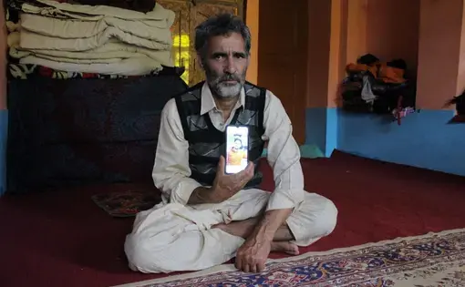 man holds phone