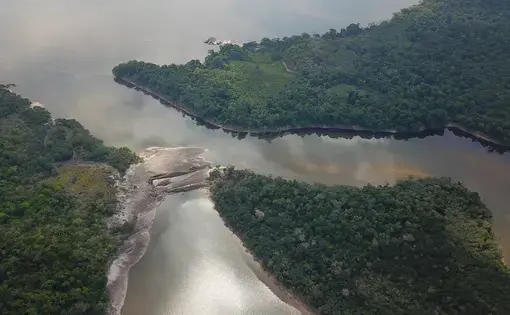 An aerial shot of two rivers merging.