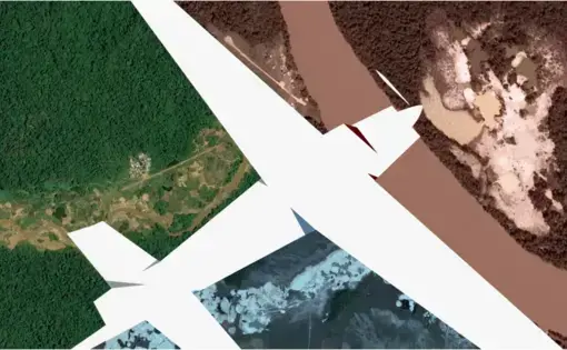 An airplane flies over a tropical rainforest.