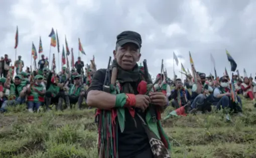 a man stands in front of group