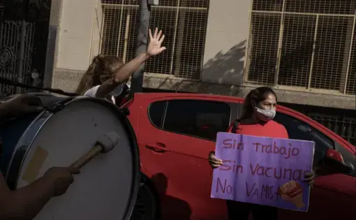 Woman standing by car