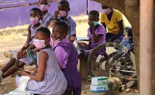 children at primary school in Ghana wearing masks