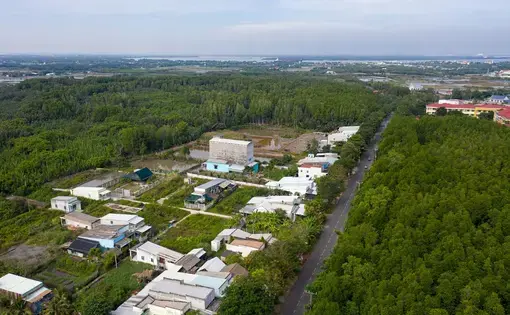 An aerial overview of a residential area near a deforested area in Vietnam.