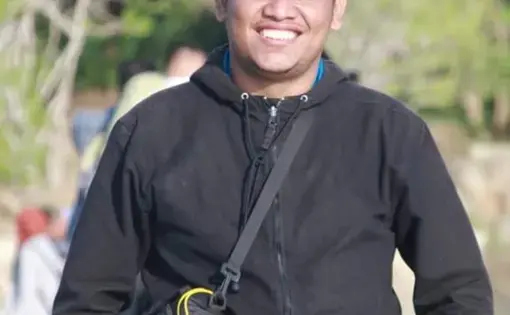 A man wearing a black long-sleeve.