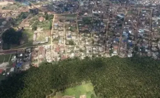 An aerial overview of a town and its deforested area in DRC Congo.