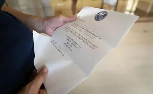 Woman holds bill