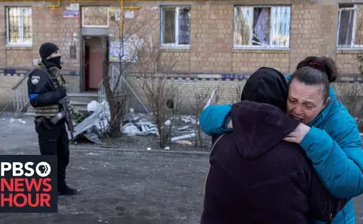 Women hugs another sobbing