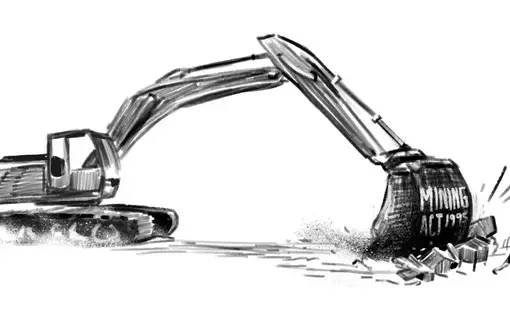 A person drives an excavator.