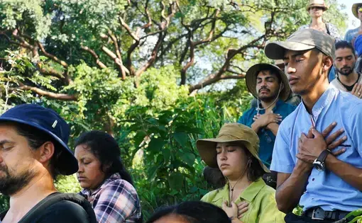 Santos Istazuy Pérez (right) sits in meditation