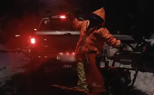 of Joe's friends and employees starting a snow blower