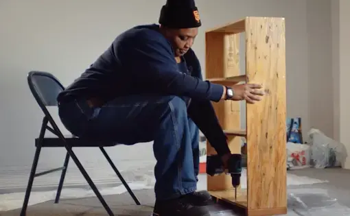 Woman builds shelf