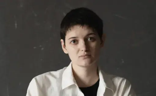 Woman sits on a chair