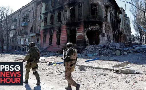 Soldiers walk through