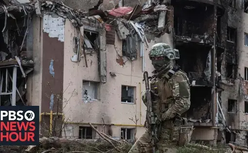 soldier walking through rubble