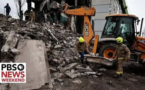 firemen inspect rubble