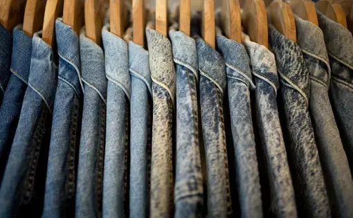 a line of denim jackets