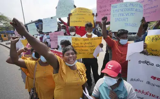 woman holds signs