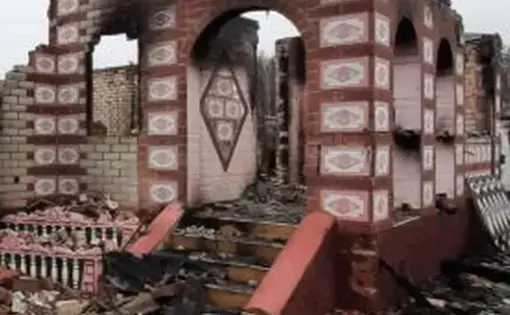 a house reduced to rubble with ornate bricks